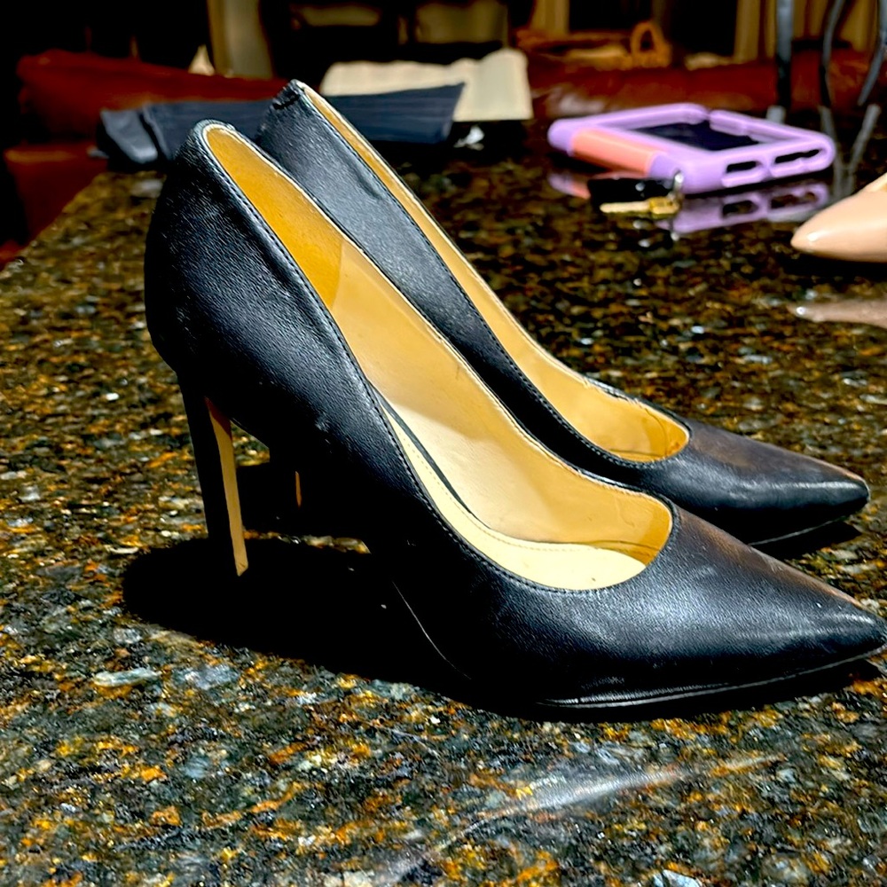 Black leather pointy toe heels by Nine West.